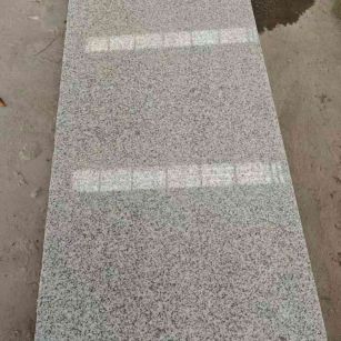 中卫芝麻白光面毛板